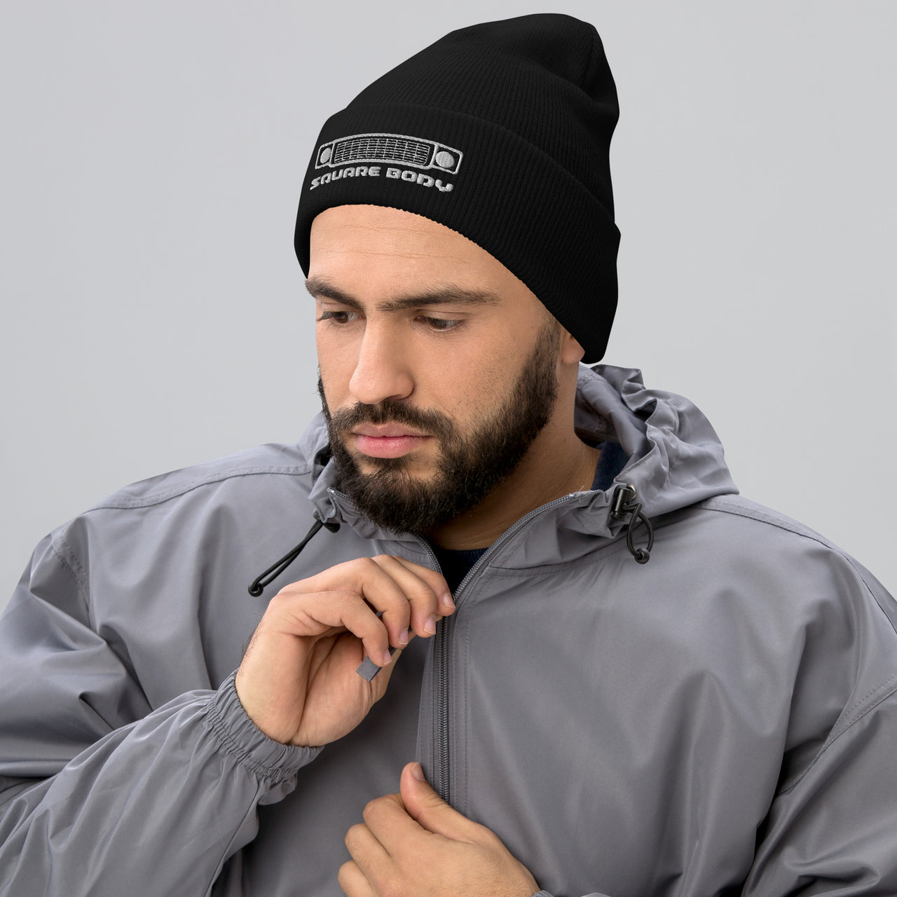 Squarebody Square Body Round Eye Winter Hat Cuffed Beanie modeled in black