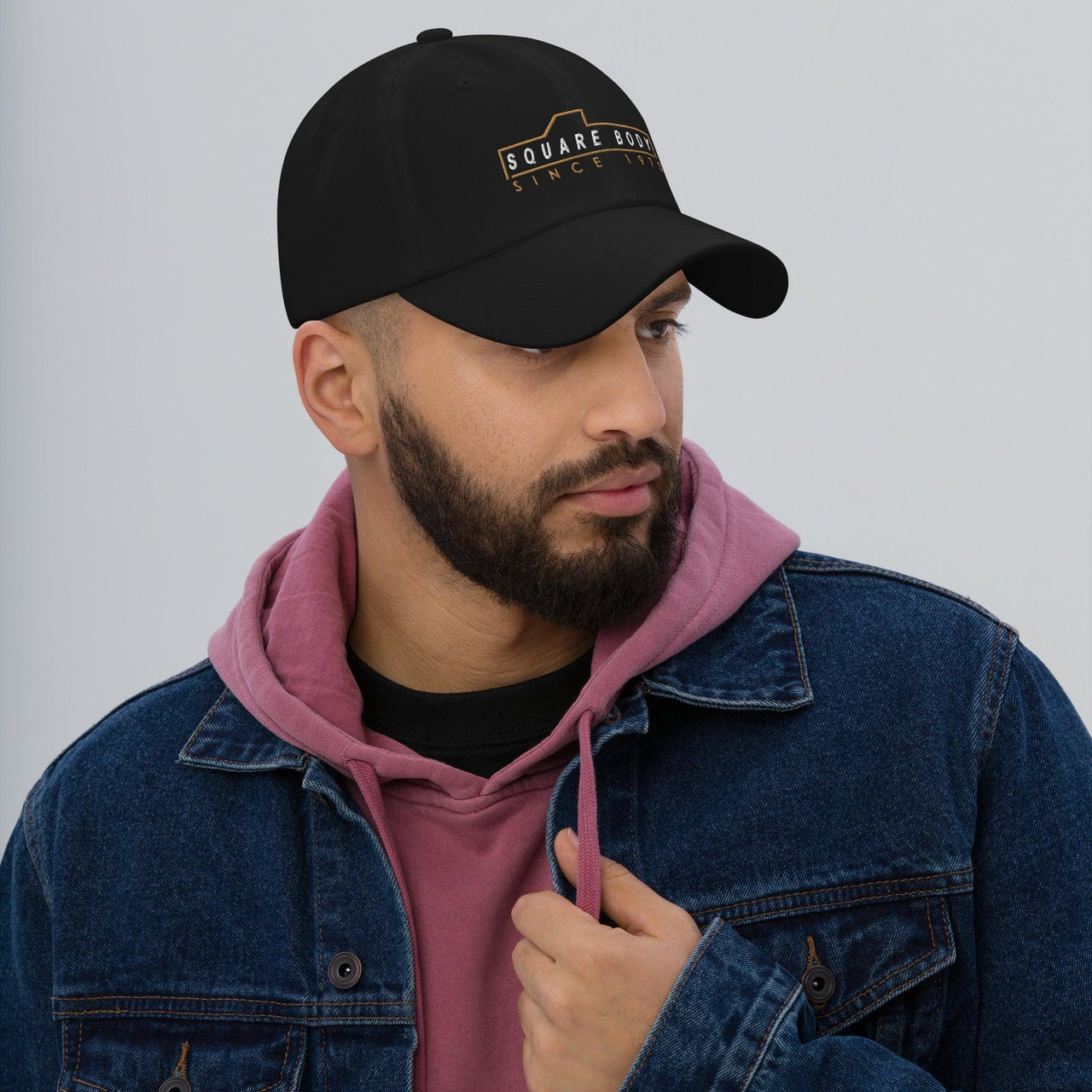 man wearing a Square body hat from aggressive thread in black