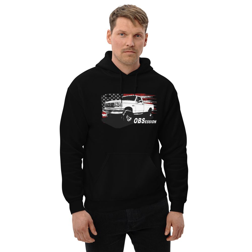Man Wearing a Single Cab OBS Ford 4x4 Hoodie With American Flag Background - Aggressive Thread auto Apparel - Color Black