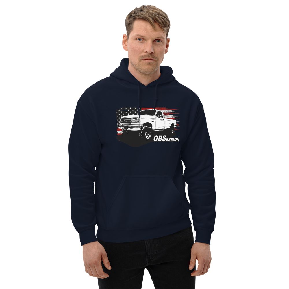 Man Wearing a Single Cab OBS Ford 4x4 Hoodie With American Flag Background - Aggressive Thread auto Apparel - Color Navy
