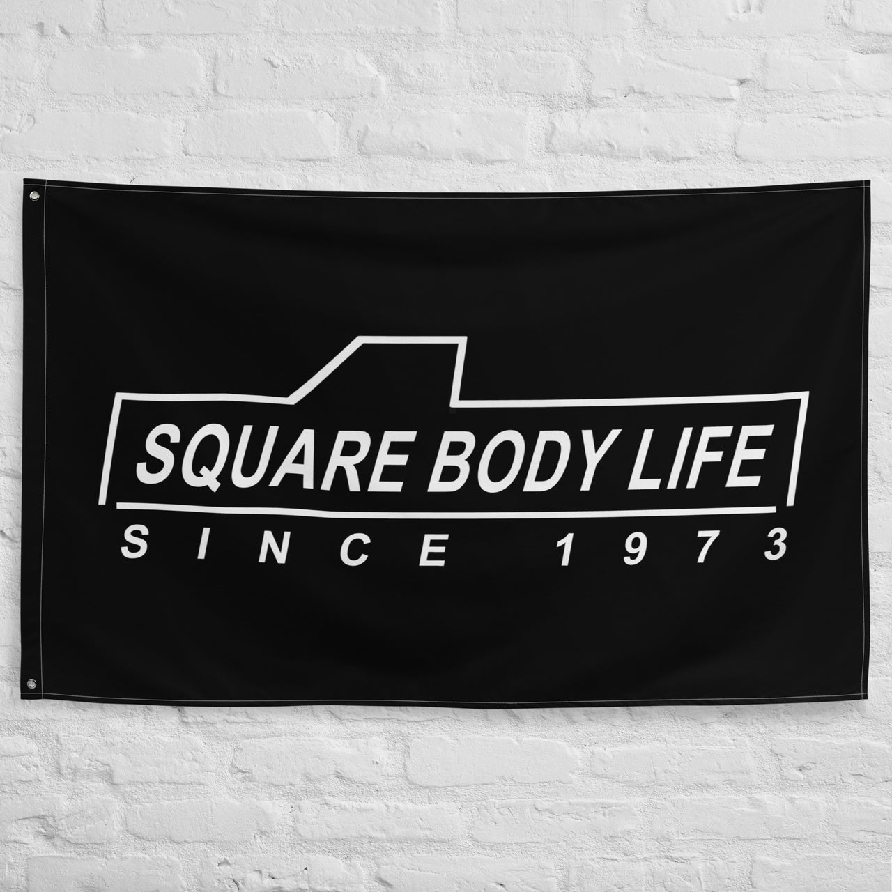 Squarebody Flag - Square Body Life hung on wall
