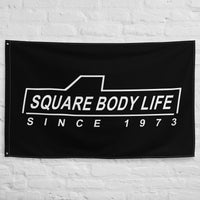 Thumbnail for Squarebody Flag - Square Body Life hung on wall