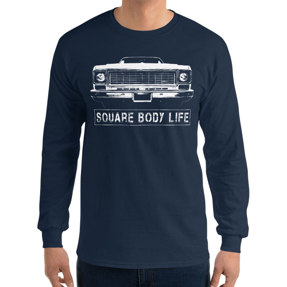 Man wearing a 73-75 Square Body Long Sleeve Shirt in navy from Aggressive Thread