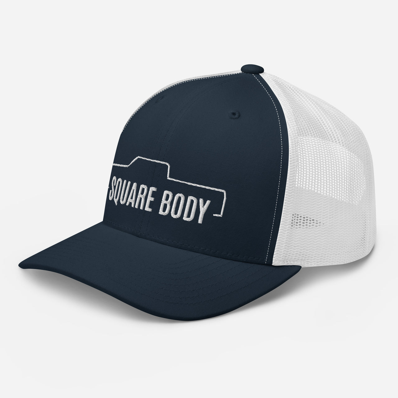 3/4 view of Crew Cab Square Body Trucker Hat From Aggressive Thread in Navy and White